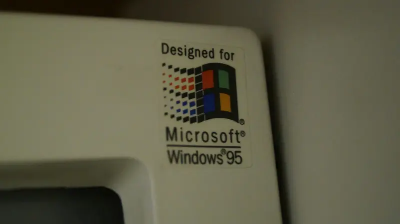 Close-Up Of A “Designed For Microsoft Windows 95” Sticker On Old Computer Hardware