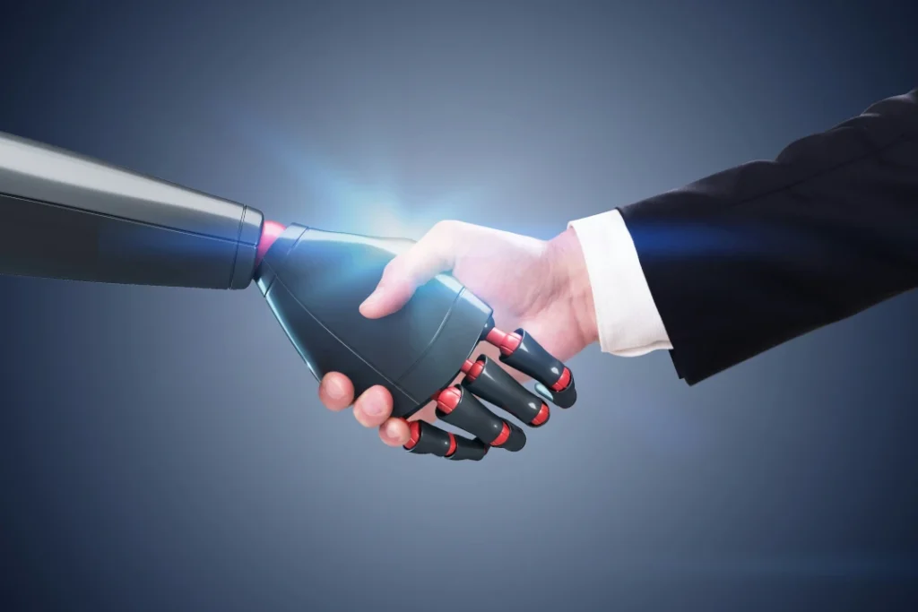 Close-up of a human hand shaking hands with a robotic hand, symbolizing artificial intelligence, trust, and collaboration between humans and technology.
