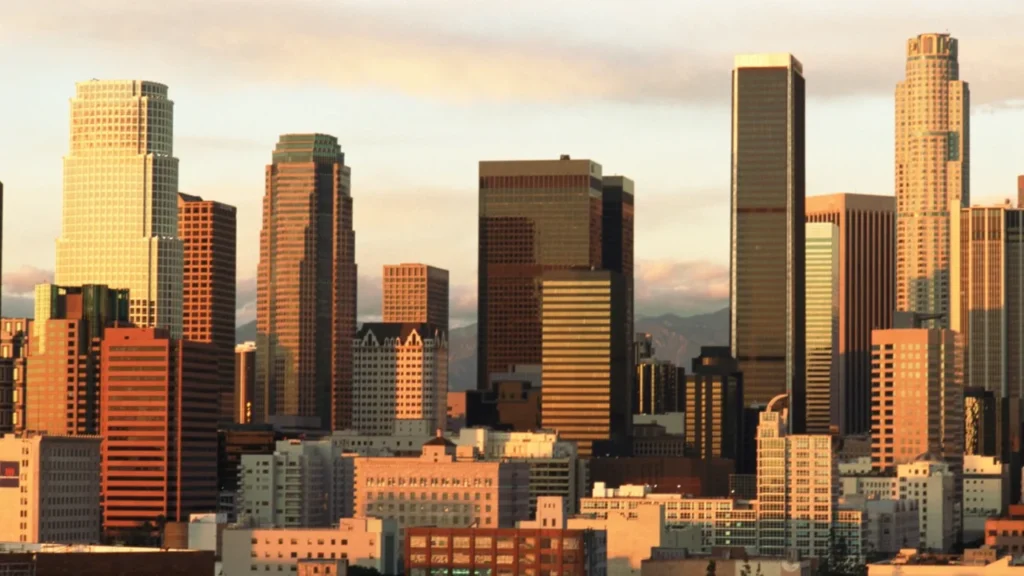 Ai Agents For Small Business: Practical Automation Every Colorado Company Can Use Today 7 Downtown Los Angeles Skyline At Sunset Showcasing A Major Urban Business Center With Modern High-Rise Office Buildings