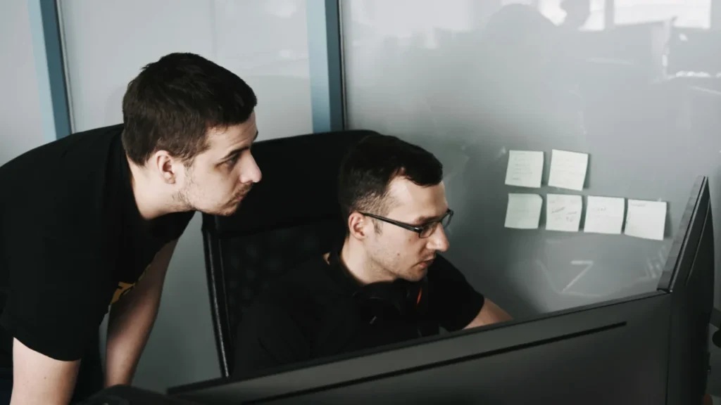 It Support Professionals Troubleshooting Issues On A Small Business Computer System