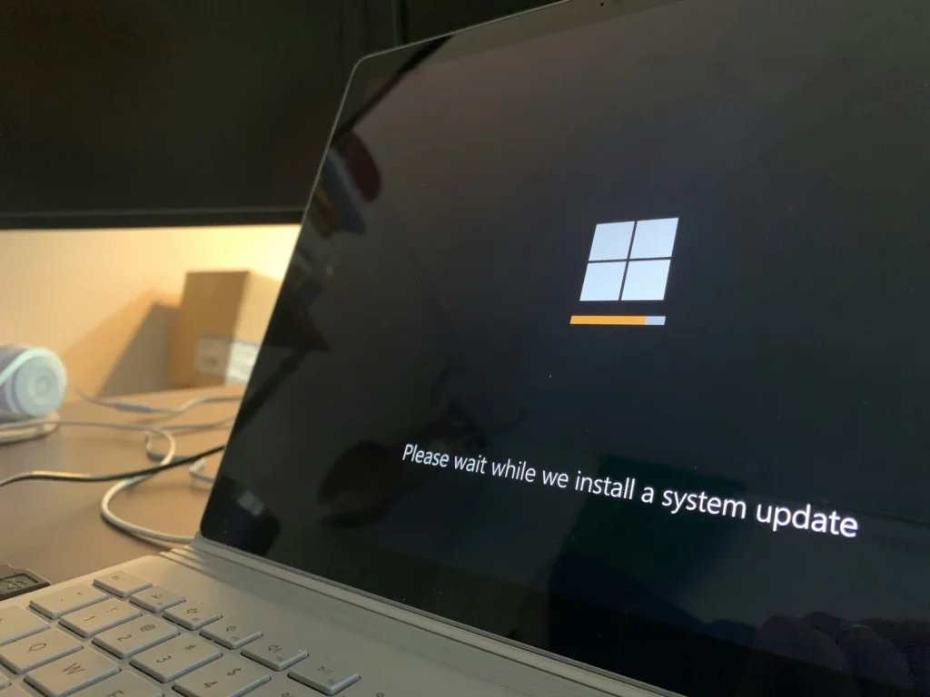 Microsoft Publisher Alternatives: The 10 Best Options For Small Businesses In 2026 5 Windows Laptop Installing An Operating System Update As Part Of Evaluating Microsoft Publisher Alternatives