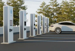 White electric vehicle charging at a station among multiple EV chargers