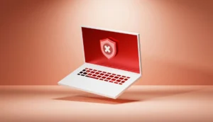 Laptop Screen Showing Ransomware Warning Symbol Representing Cybersecurity Risks For Small Businesses
